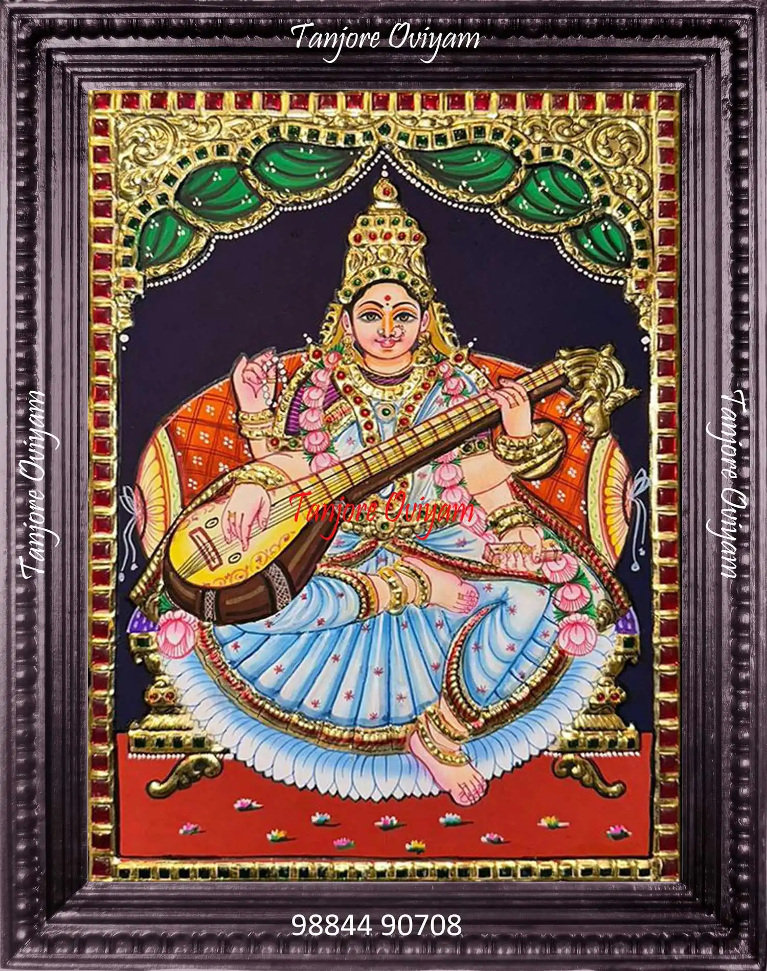 Traditional Saraswathi Tanjore painting with veena, lotus and gold foil detailing